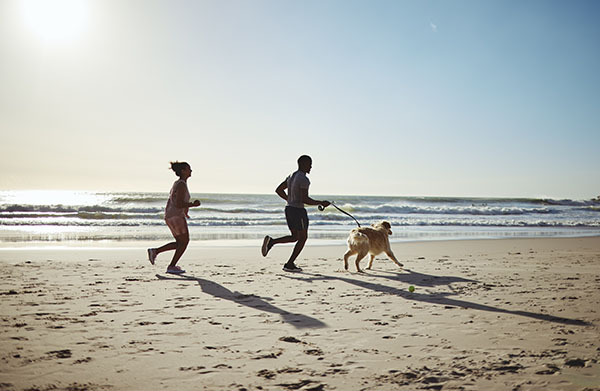 Couple running on the beach