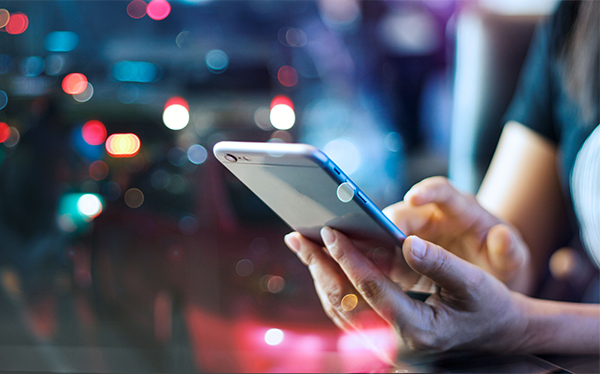 Mobile phone; city lights 